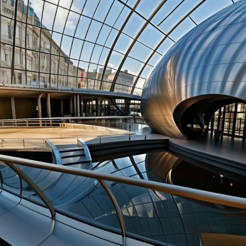 Futuristic Science Museum with Organic Shapes: A futuristic building designed with flowing, organic shapes and a metallic, reflective surface. The architecture has an avant-garde feel, with curving walls, rounded forms, and expansive glass panels, resembling a spaceship.