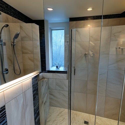 Bathroom and Tile Showroom with Vanity Displays: A bathroom showroom featuring a variety of sinks, bathtubs, and shower setups. Each display showcases different tile patterns and finishes, allowing customers to envision bathroom designs. Spotlights and mirrors enhance the elegance of each display.